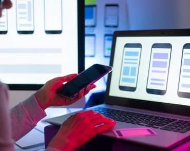 Phone in hand while using computer